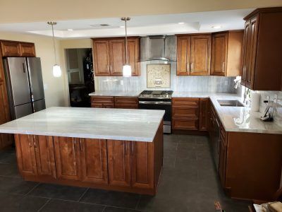Hunter Pass, Kitchen remodel with new layout, huge kitchen island, marble countertops, mosaic over stove, new hood range, All Access Construction Inc