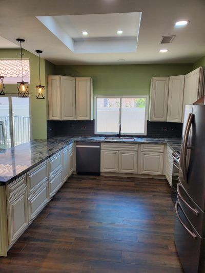 Kitchen remodel move walls move window expand floor plan new lighting new floors All Access Construction inc after picture