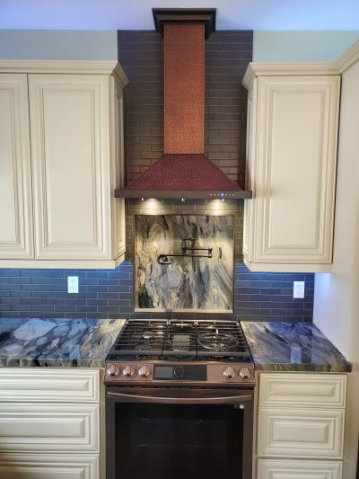 Kitchen remodel pot filler hood vent quartzite countertops All Access Construction inc